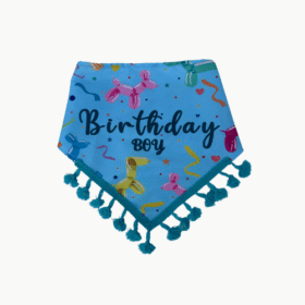 Blue birthday bandana with balloon illustrations and the words 'Birthday Boy' edged with teal tassels.