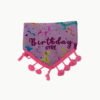 Pink birthday-themed bandana with fringed tassels, featuring balloons and the words 'Birthday Girl' across the front.