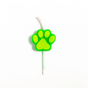 Green paw-print candle on a white stick with a wick at the top.